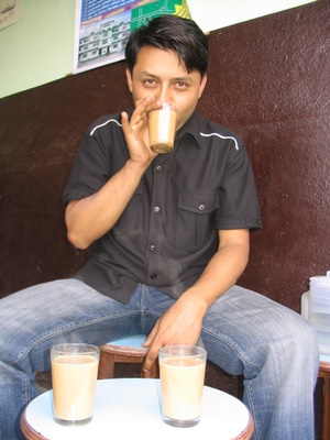 deepak adhikari sipping tea