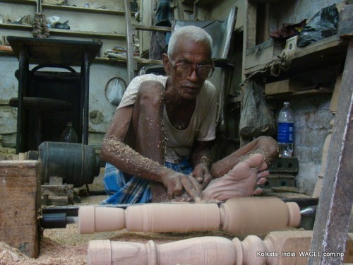 Man at work on MG Road, Kolkata