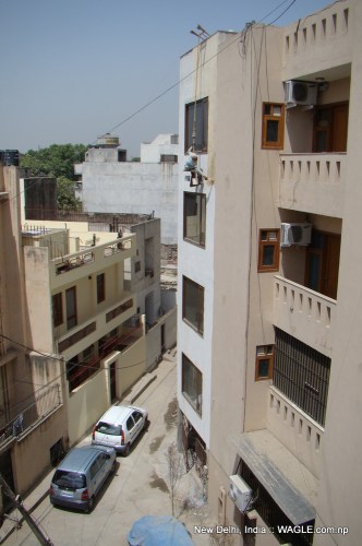 man at work: A labourer paints a house in New Delhi's Jangpura Extension neighbourhood