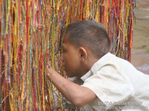Prayer threads and a kid in Budha Subba
