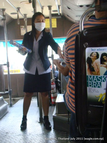 bangkok lady collector in a bus