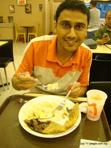 Manila food: rice, fish, egg and mushroom