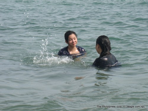 the philippines: a mom and her daughter in the sea