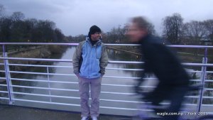 A cyclist passed by as Dinesh Wagle posed for camera at the Millennium Bridge over River Ouse in York. Pic by Bishnu Pariyar