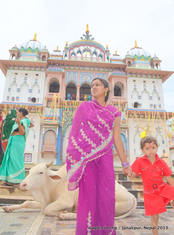 A woman waited for her family members as she held her child in Janaki temple complex in Janakpurdham.