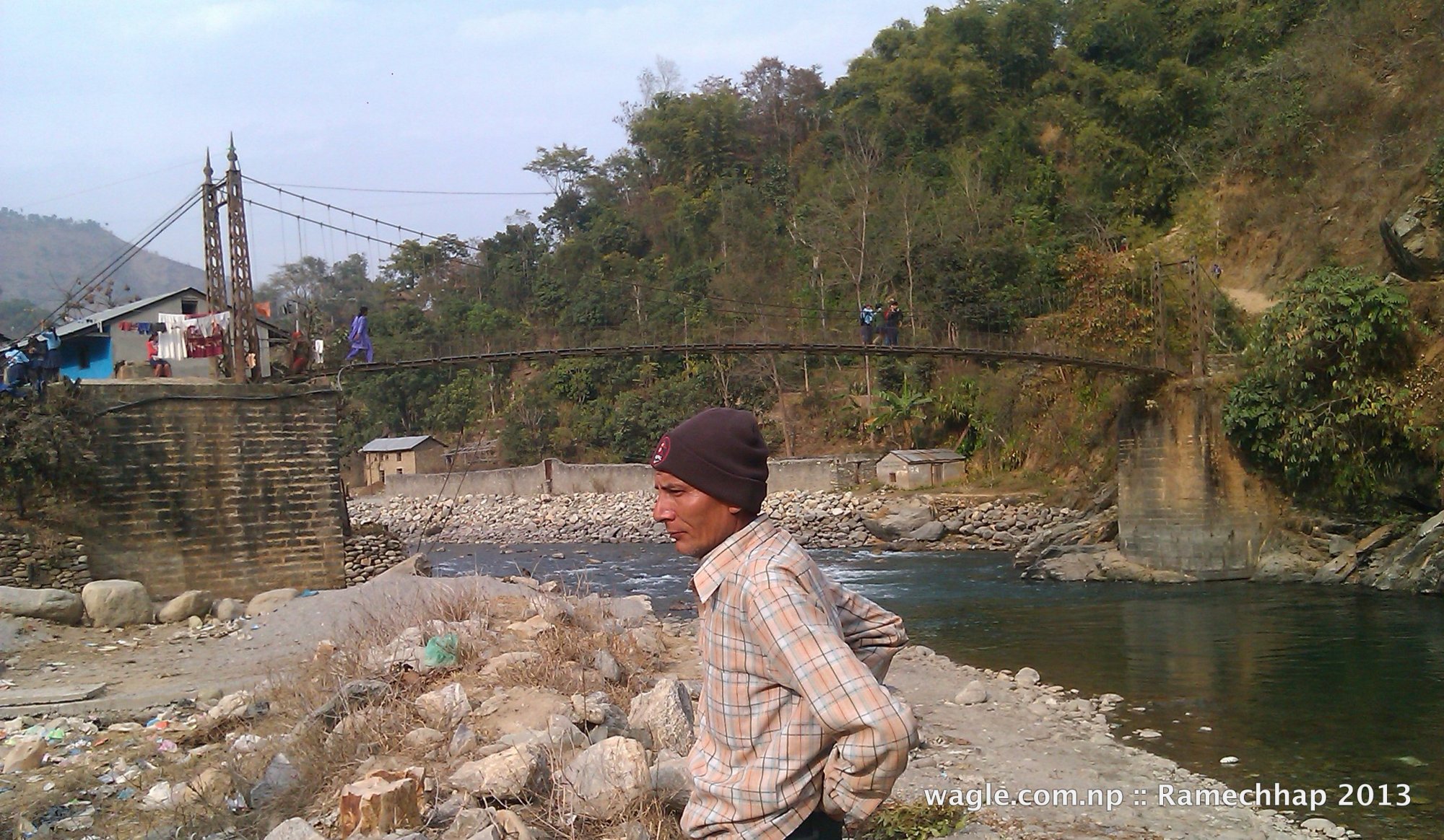 Likhu Khola. Ramechhap district on this side of the river, Okhaldhunga district on that side of the river.