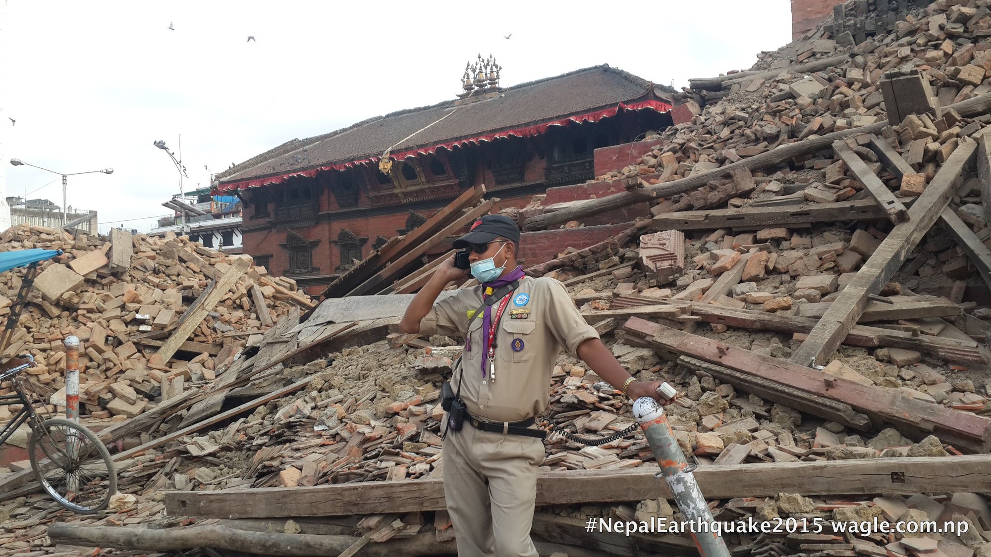 Ruins of the Trailokya Mohan Temple. Kumari House which survived the quake, in the background.