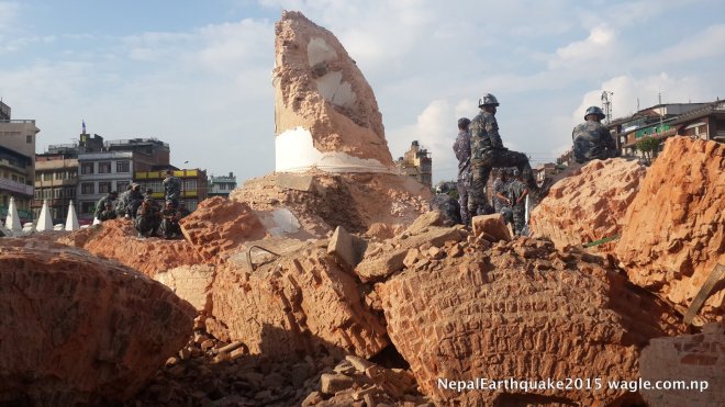 Policemen guard the ruins of the fallen Dharahara