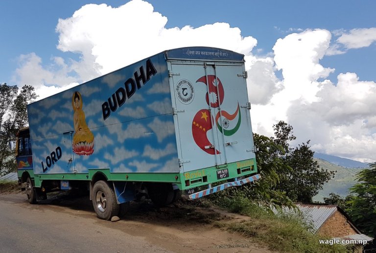 A truck with flags of Nepal China and India
